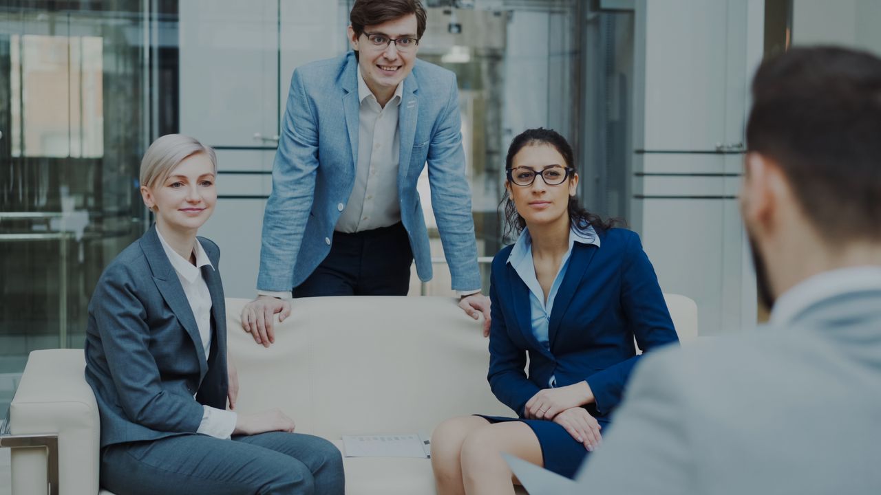 Professional business team having a meeting inside a modern office environment.